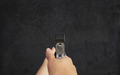 Red dot sight mounted on a pistol.